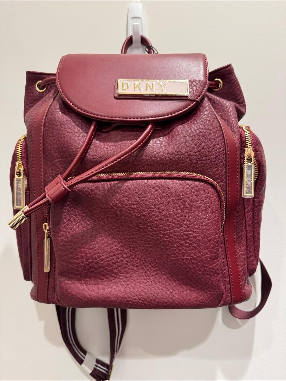 DKNY Burgundy Pebbled Leather Drawstring Backpack with Gold Hardware
